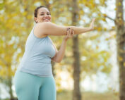 round woman exercising outdoors